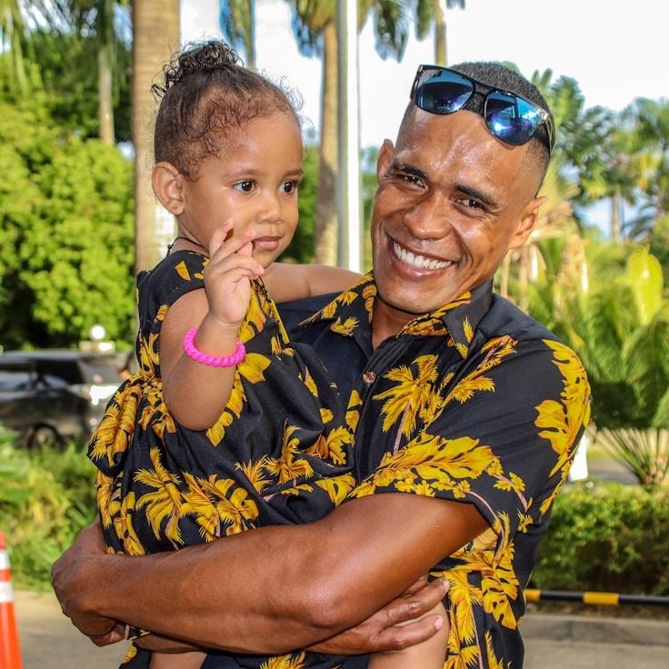 Avery Cole, Lead Design Curator at Dune Flow Vector, reviewing corporate floral arrangements